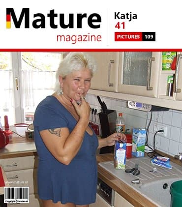 Mature woman covers her body with chocolate pudding