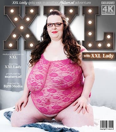 Huge XXL Lady is a BBW with huge saggy natural tits masturbating in bed