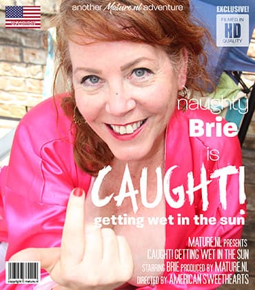 Mature Brie with her long hard nipples is getting caught playing with herself in the garden