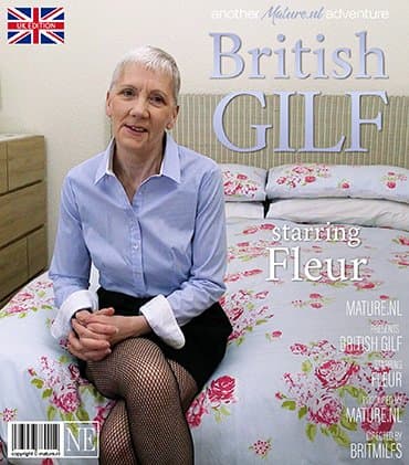 Horny British granny Fleur rubbing her mature pussy on bed